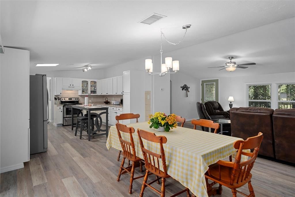 Dining room, Interior, Kitchen, Living room, Pendant Lights, Stainless Steel Appliances, Wood Texture Flooring
