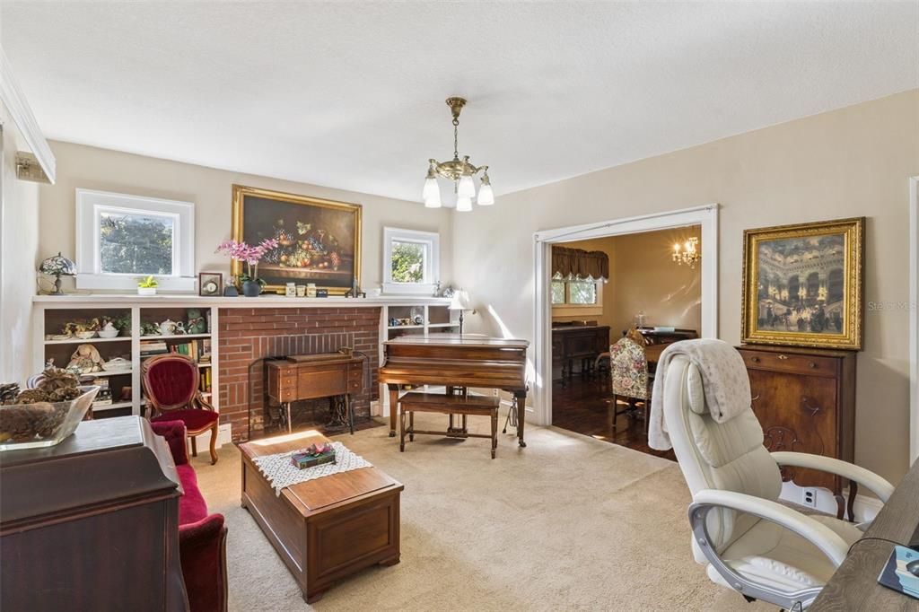 Fireplace, Interior, Pendant Lights, Piano, Wood Texture Flooring