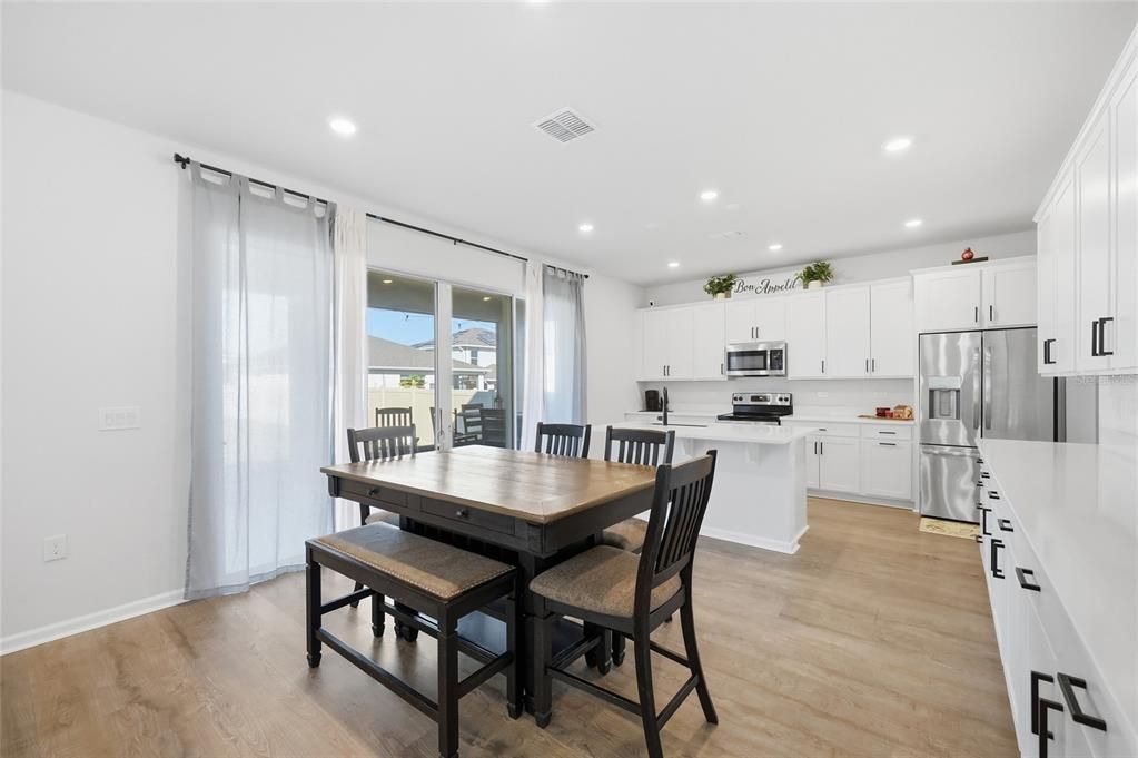 Dining room, Interior, Kitchen, Recessed Lighting, Stainless Steel Appliances, Wood Texture Flooring