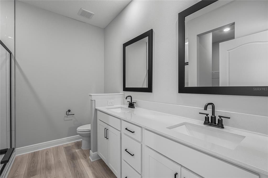 Bathroom, Dual Sink Vanities, Interior, Recessed Lighting, Wood Texture Flooring