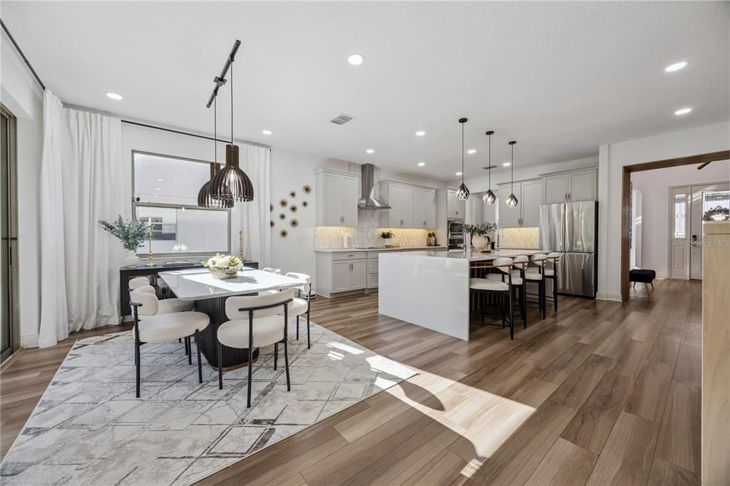 Dining room, Interior, Kitchen, Pendant Lights, Recessed Lighting, Stainless Steel Appliances, Wood Texture Flooring