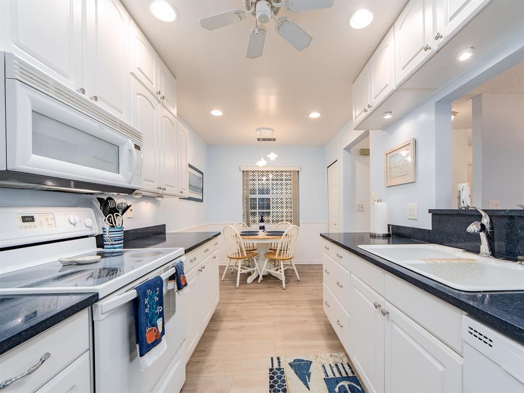 Chandelier, Dining room, Interior, Kitchen, Recessed Lighting, Wood Texture Flooring