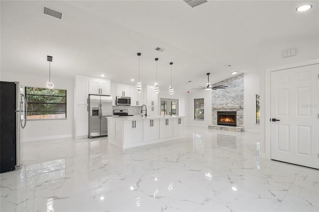Fireplace, Interior, Kitchen, Marble, Pendant Lights, Recessed Lighting, Stainless Steel Appliances