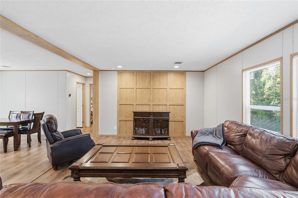 Dining room, Fireplace, Interior, Living room, Recessed Lighting, Wood Texture Flooring