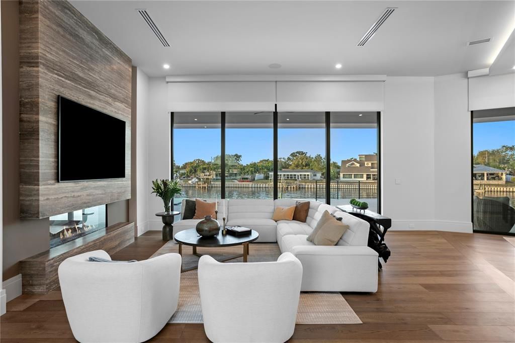 Fireplace, Interior, Living room, Recessed Lighting, Water, Wood Texture Flooring