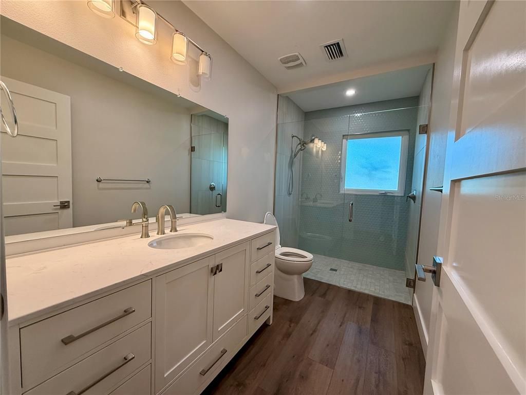 Bathroom, Glass Shower, Interior, Recessed Lighting, Wood Texture Flooring