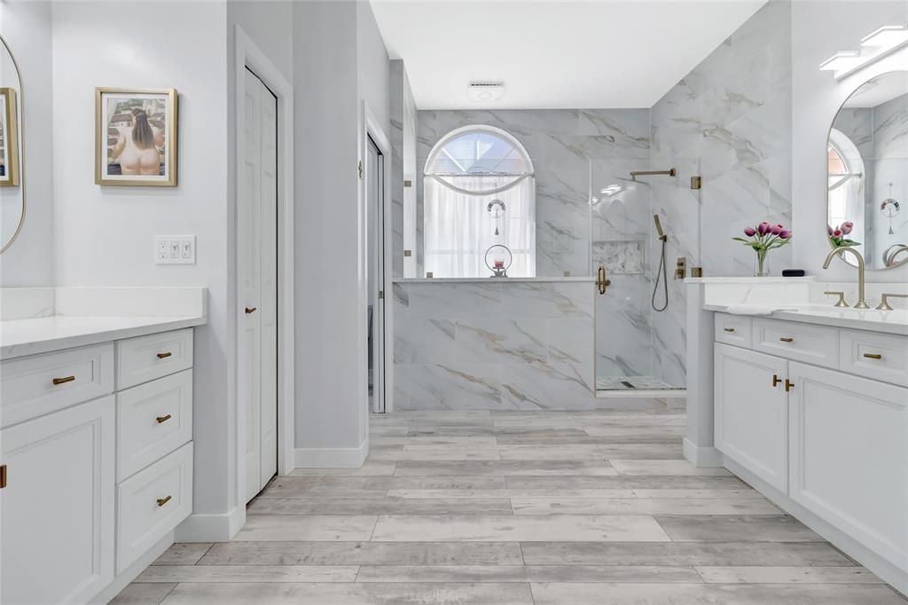 Bathroom, Dual Sink Vanities, Glass Shower, Interior, Marble, Marble Walls, Wood Texture Flooring