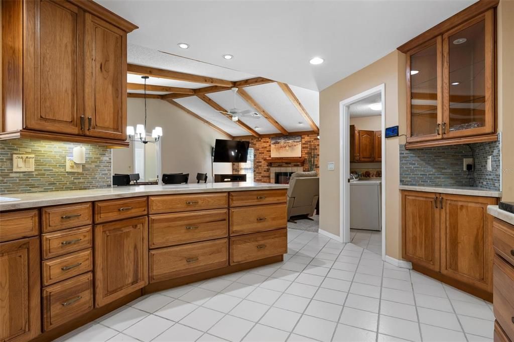 Fireplace, Interior, Kitchen, Pendant Lights, Recessed Lighting, Stone Walls, Washer, Wooden Beams