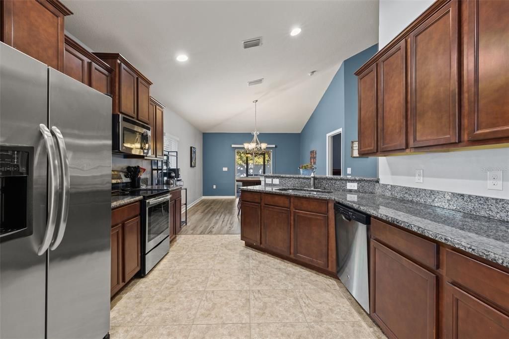 Chandelier, Interior, Kitchen, Pendant Lights, Recessed Lighting, Stainless Steel Appliances, Wood Texture Flooring