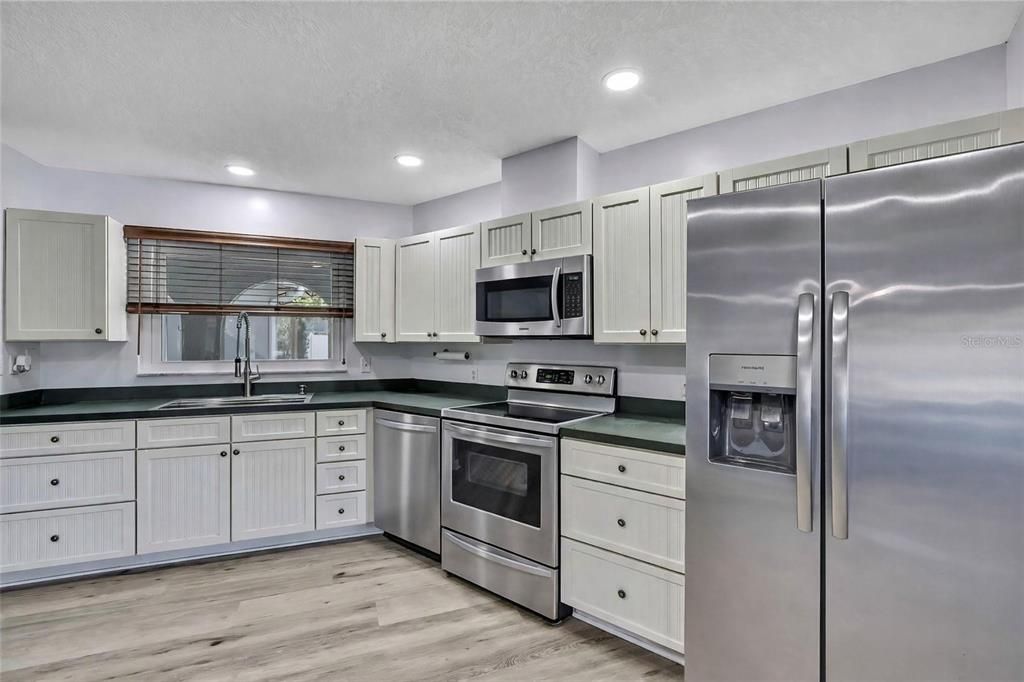 Interior, Kitchen, Recessed Lighting, Stainless Steel Appliances, Wood Texture Flooring