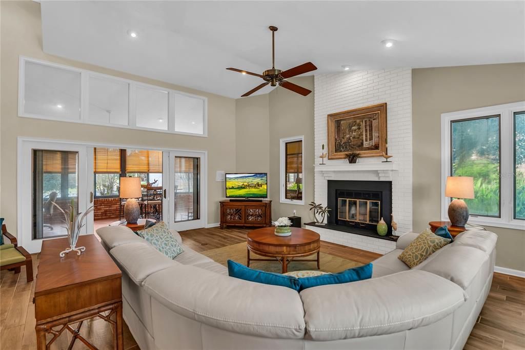 Fireplace, Interior, Living room, Recessed Lighting, Stone Walls, Wood Texture Flooring