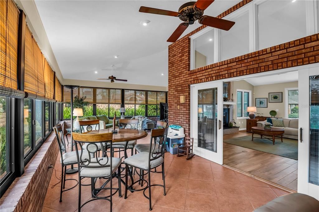 Dining room, Fireplace, Interior, Living room, Recessed Lighting, Stone Walls, Wood Texture Flooring