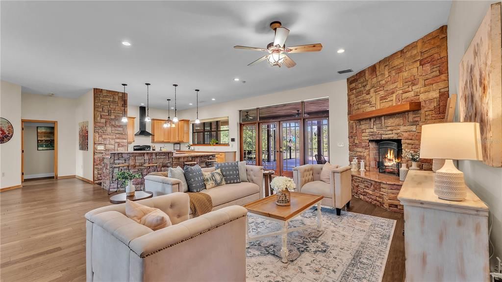 Fireplace, Interior, Kitchen, Living room, Pendant Lights, Recessed Lighting, Stone Walls, Wood Texture Flooring