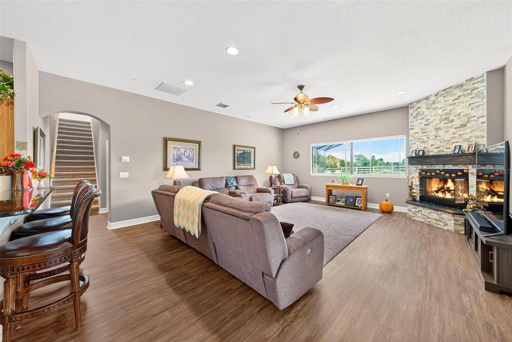 Fireplace, Interior, Living room, Recessed Lighting, Stone Walls, Wood Texture Flooring