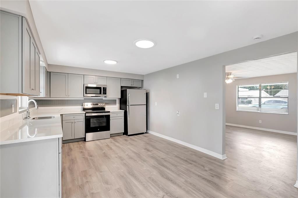 Interior, Kitchen, Recessed Lighting, Stainless Steel Appliances, Wood Texture Flooring