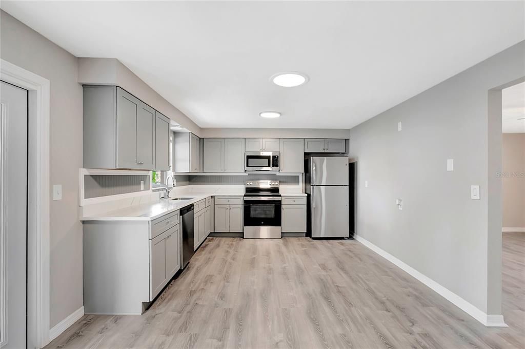 Interior, Kitchen, Recessed Lighting, Stainless Steel Appliances, Wood Texture Flooring