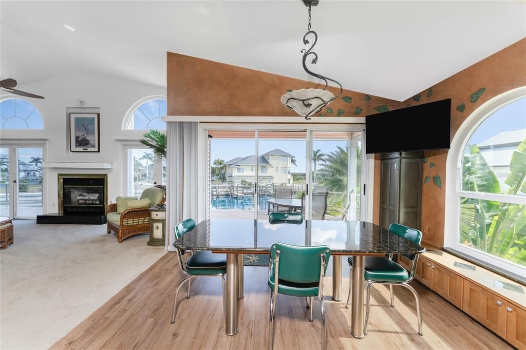 Dining room, Fireplace, Interior, Recessed Lighting, Water, Wood Texture Flooring