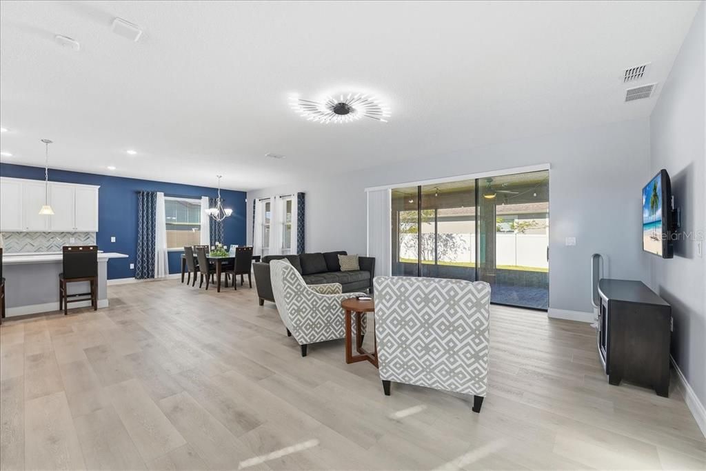 Chandelier, Dining room, Interior, Kitchen, Living room, Pendant Lights, Recessed Lighting, Wood Texture Flooring