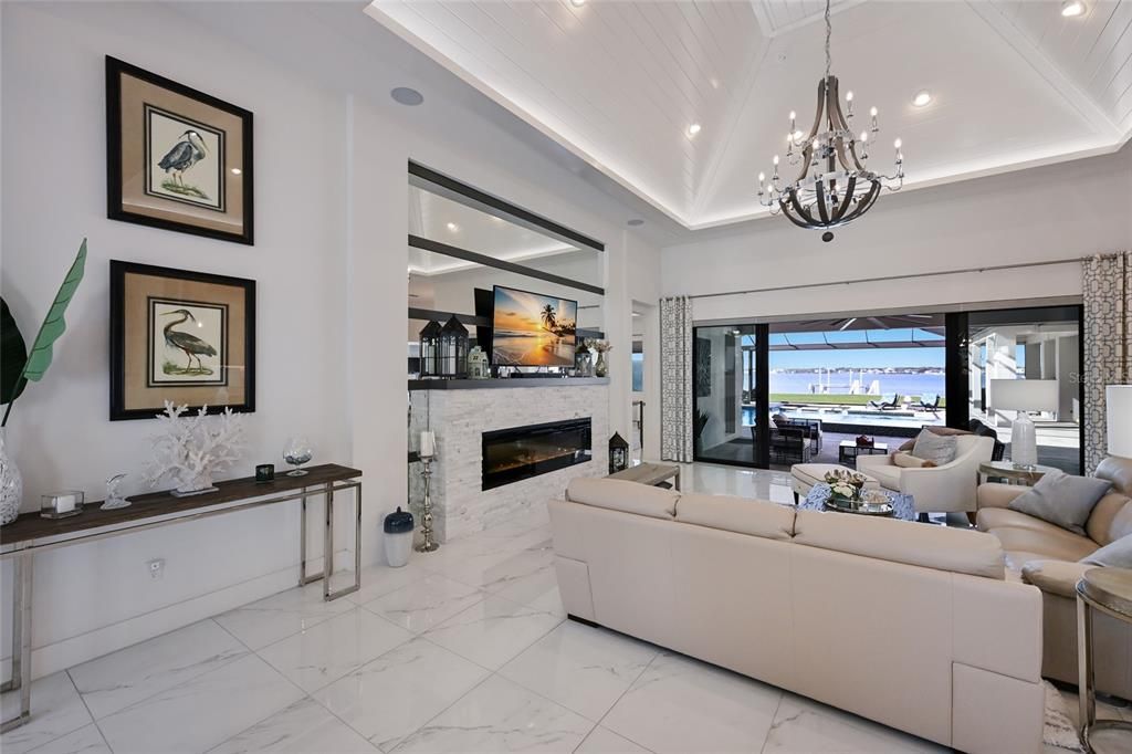 Chandelier, Fireplace, Interior, Living room, Marble, Pendant Lights, Recessed Lighting, Water