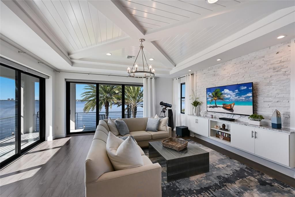 Fitness Equipment, Interior, Living room, Recessed Lighting, Stone Walls, Water, Wood Texture Flooring