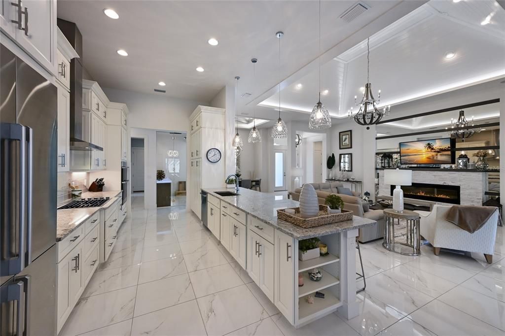 Fireplace, Interior, Kitchen, Living room, Marble, Pendant Lights, Recessed Lighting, Stainless Steel Appliances