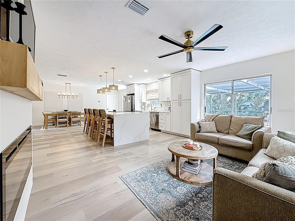 Dining room, Interior, Kitchen, Living room, Pendant Lights, Recessed Lighting, Stainless Steel Appliances, Wood Texture Flooring