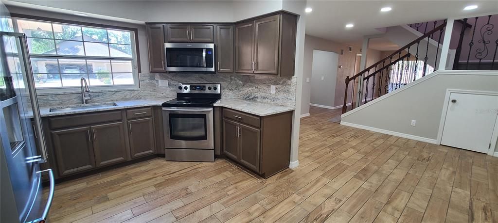 Interior, Kitchen, Recessed Lighting, Stainless Steel Appliances, Wood Texture Flooring