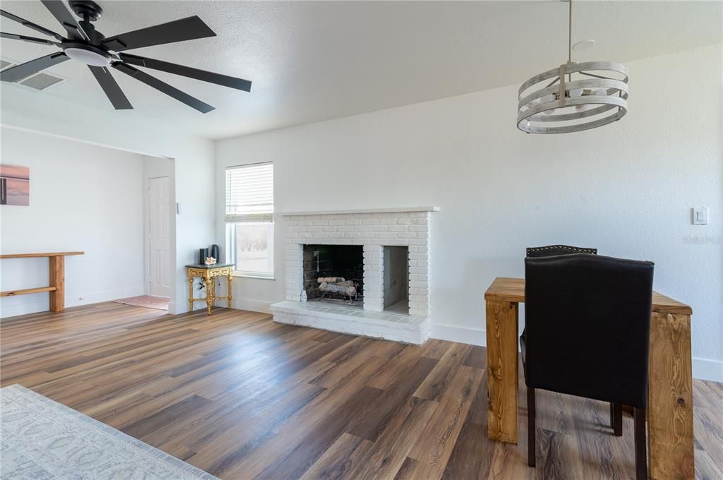 Dining room, Fireplace, Interior, Pendant Lights, Wood Texture Flooring