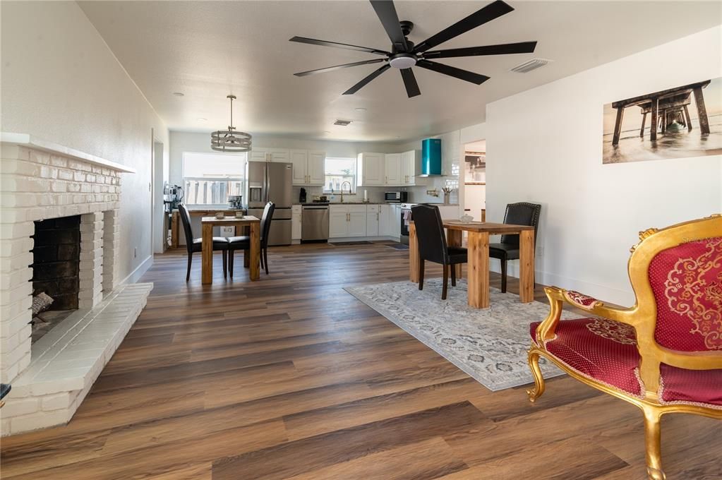 Dining room, Fireplace, Interior, Kitchen, Pendant Lights, Wood Texture Flooring