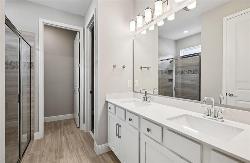 Bathroom, Dual Sink Vanities, Glass Shower, Interior, Recessed Lighting, Wood Texture Flooring