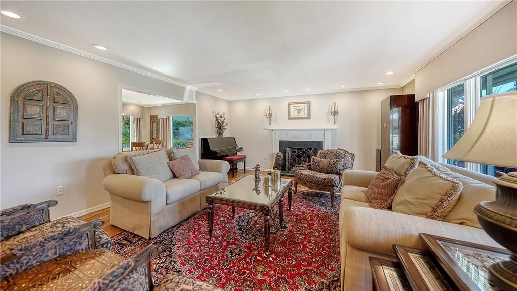 Fireplace, Interior, Living room, Piano, Recessed Lighting, Wood Texture Flooring