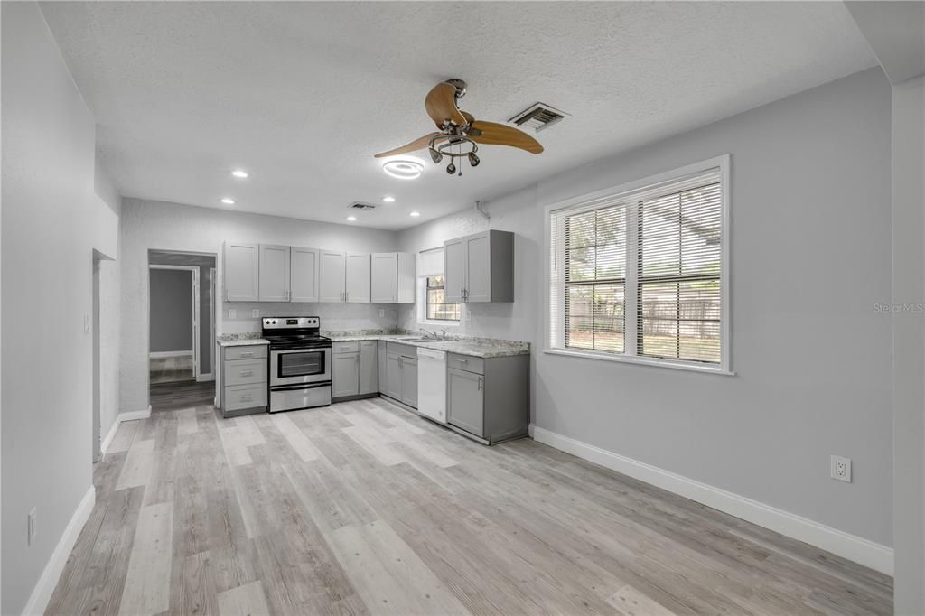 Interior, Kitchen, Recessed Lighting, Stainless Steel Appliances, Wood Texture Flooring