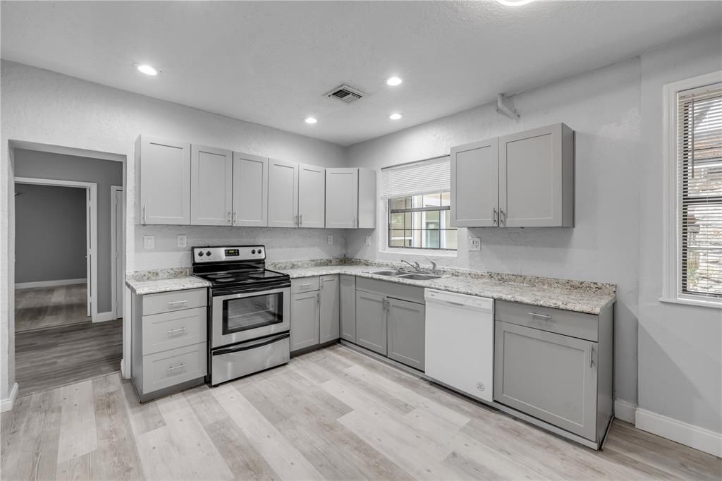 Interior, Kitchen, Recessed Lighting, Stainless Steel Appliances, Wood Texture Flooring