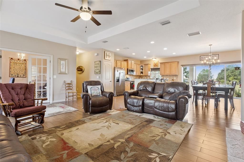 Chandelier, Dining room, Interior, Kitchen, Living room, Recessed Lighting, Stainless Steel Appliances, Wood Texture Flooring