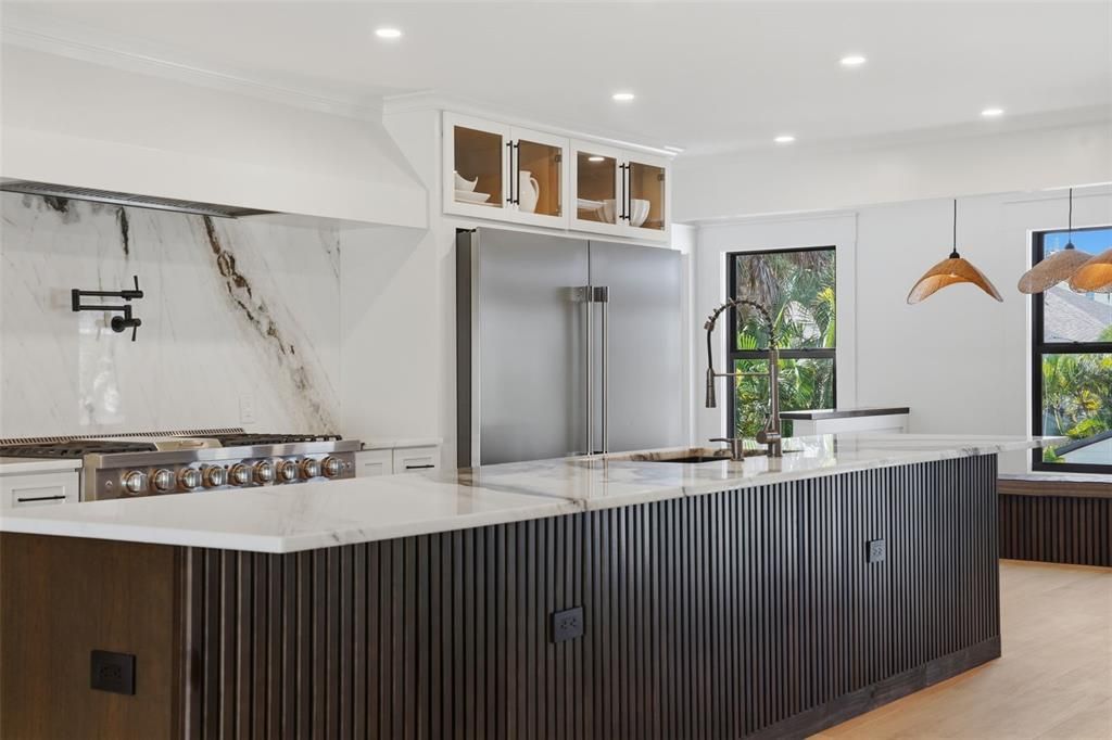 Interior, Kitchen, Marble Walls, Pendant Lights, Recessed Lighting, Stainless Steel Appliances, Wood Texture Flooring