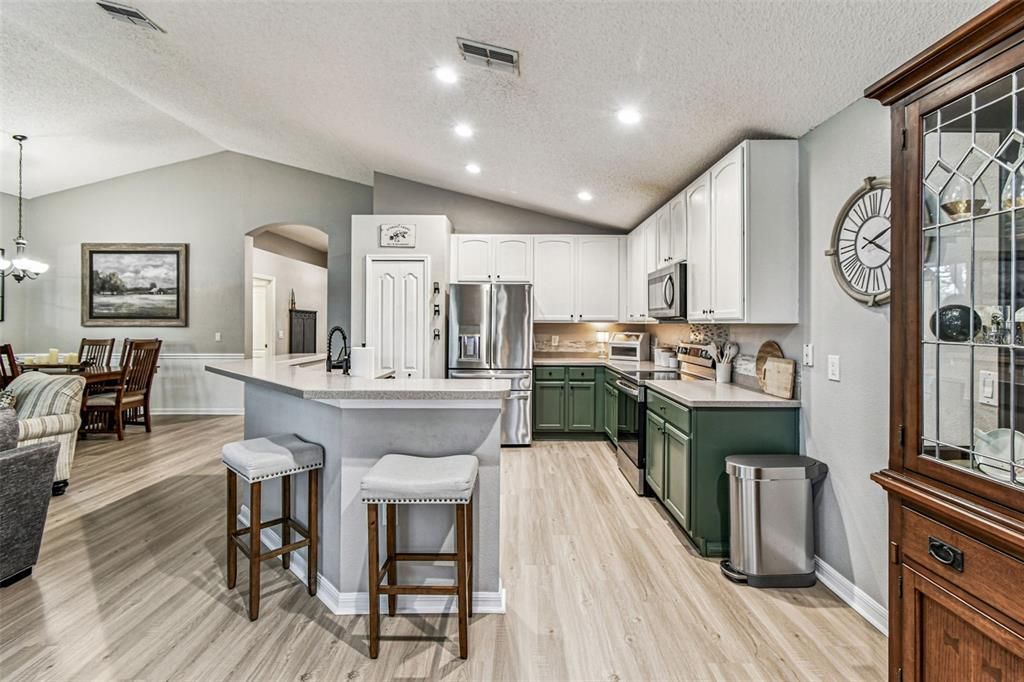Dining room, Interior, Kitchen, Pendant Lights, Recessed Lighting, Stainless Steel Appliances, Wood Texture Flooring