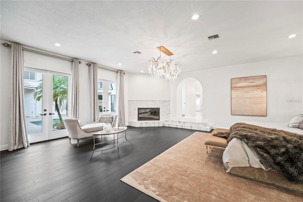 Bedroom, Chandelier, Fireplace, Interior, Recessed Lighting, Wood Texture Flooring