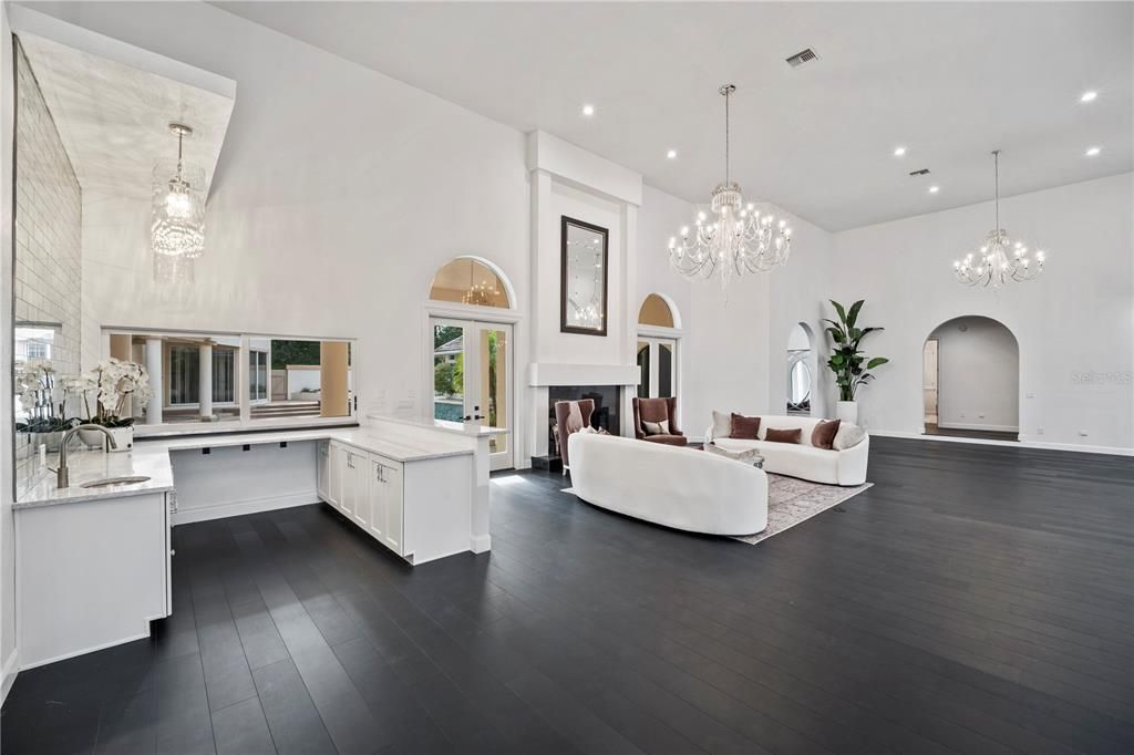 Chandelier, Fireplace, Interior, Living room, Pendant Lights, Recessed Lighting, Wood Texture Flooring