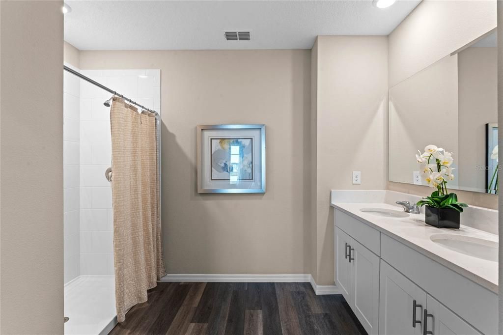Bathroom, Dual Sink Vanities, Interior, Recessed Lighting, Wood Texture Flooring
