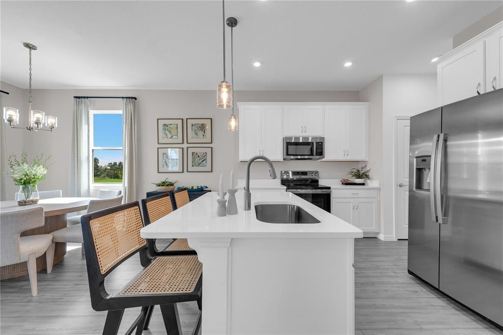 Dining room, Interior, Kitchen, Pendant Lights, Recessed Lighting, Stainless Steel Appliances, Wood Texture Flooring