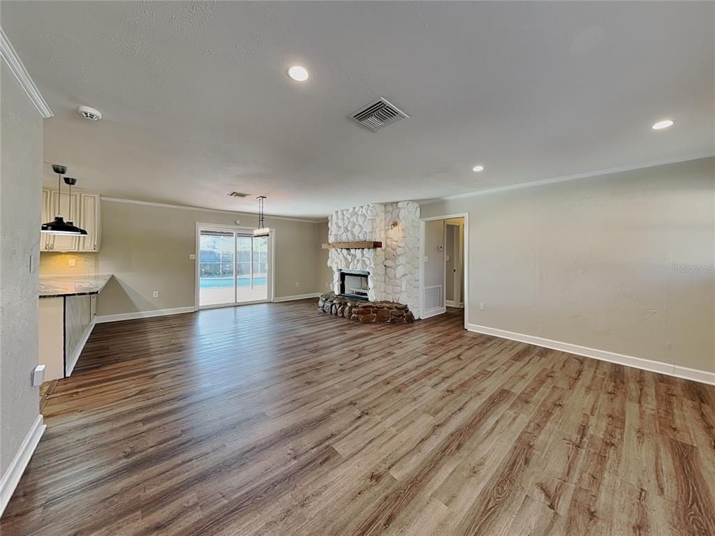 Empty room, Fireplace, Interior, Pendant Lights, Recessed Lighting, Wood Texture Flooring