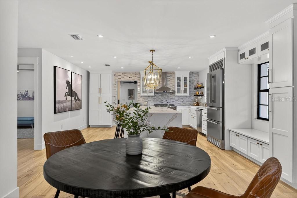 Dining room, Interior, Kitchen, Pendant Lights, Recessed Lighting, Stainless Steel Appliances, Wood Texture Flooring