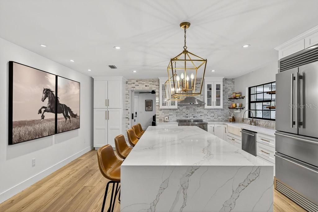 Interior, Kitchen, Pendant Lights, Recessed Lighting, Stainless Steel Appliances, Stone Walls, Wood Texture Flooring