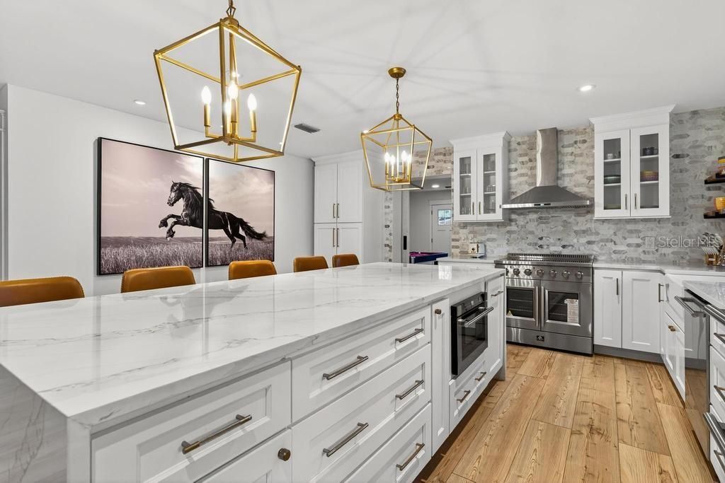 Interior, Kitchen, Pendant Lights, Recessed Lighting, Stainless Steel Appliances, Stone Walls, Wood Texture Flooring