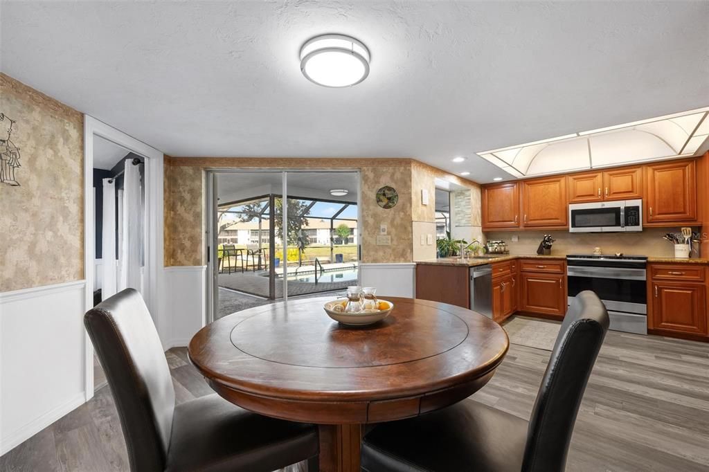 Dining room, Interior, Kitchen, Recessed Lighting, Stainless Steel Appliances, Wood Texture Flooring