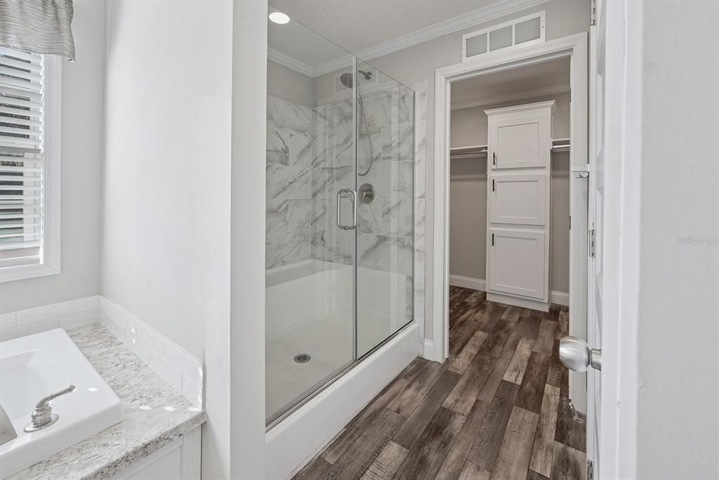 Bathroom, Glass Shower, Interior, Marble Walls, Recessed Lighting, Wood Texture Flooring
