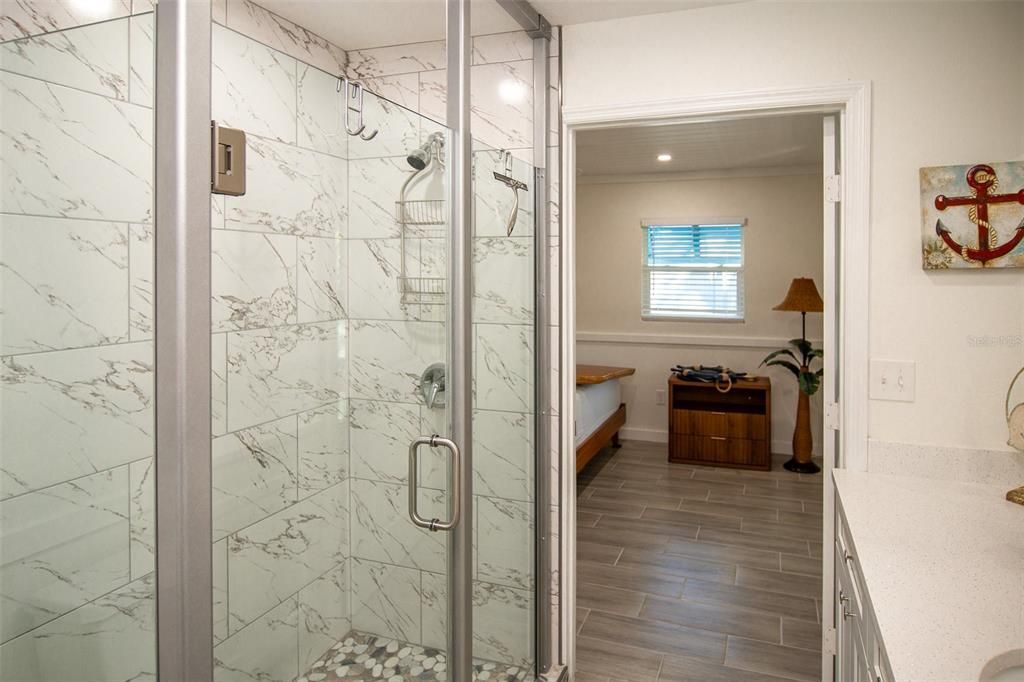 Bathroom, Glass Shower, Interior, Marble Walls, Recessed Lighting, Wood Texture Flooring