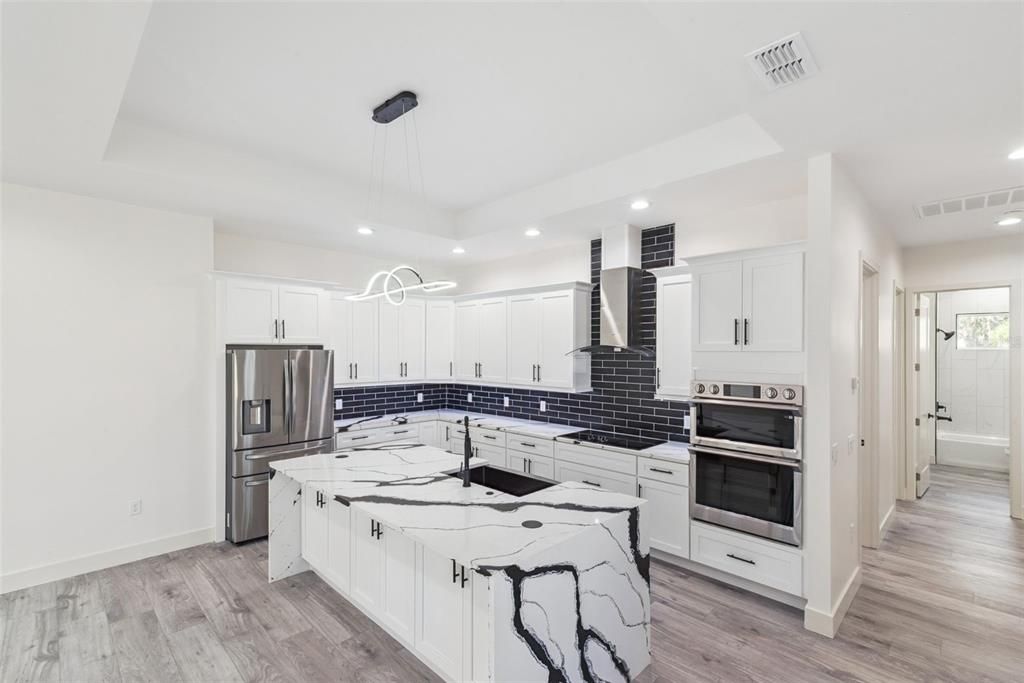 Interior, Kitchen, Pendant Lights, Recessed Lighting, Stainless Steel Appliances, Wood Texture Flooring