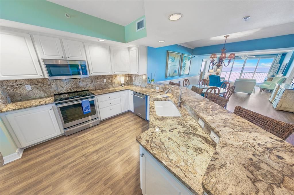 Chandelier, Dining room, Interior, Kitchen, Recessed Lighting, Stainless Steel Appliances, Wood Texture Flooring