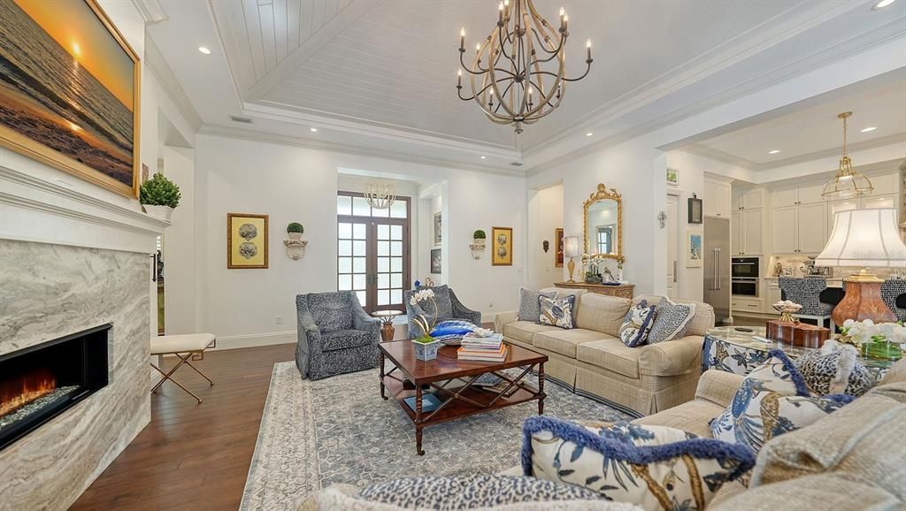 Chandelier, Fireplace, Interior, Living room, Pendant Lights, Recessed Lighting, Wood Texture Flooring